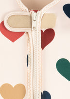 Close-up of the zipper of a Front view of a Konges Sløjd Ellis swim vest in bon coeur coloré