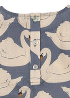 Close-up of the Konges Sløjd Evia blouse in Swan print on a white background.