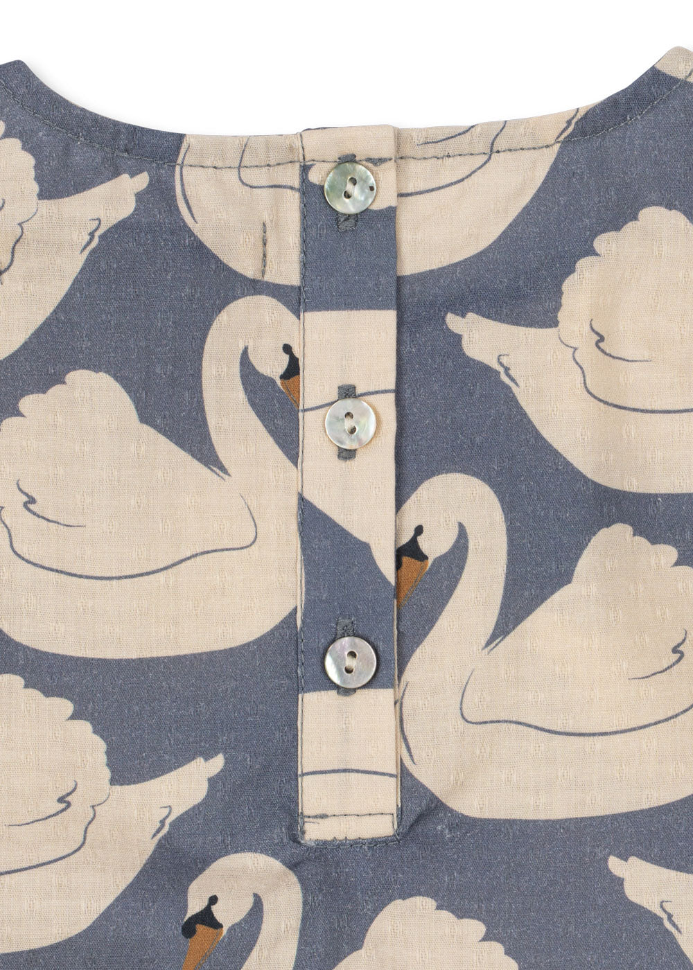 Close-up of the Konges Sløjd Evia blouse in Swan print on a white background.