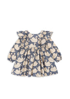 Front view of the Konges Sløjd Evia long-sleeve bow dress in Swan print on a white background.