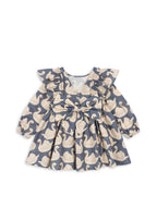 Back view of the Konges Sløjd Evia long-sleeve bow dress in Swan print on a white background.