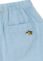 Close-up of a Konges Sløjd Fran shirts in blue check on a white background