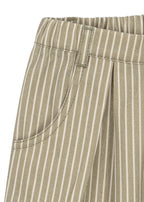 Close-up of Konges Sløjd Frankie pants in Tea stripe fabric and pocket detail