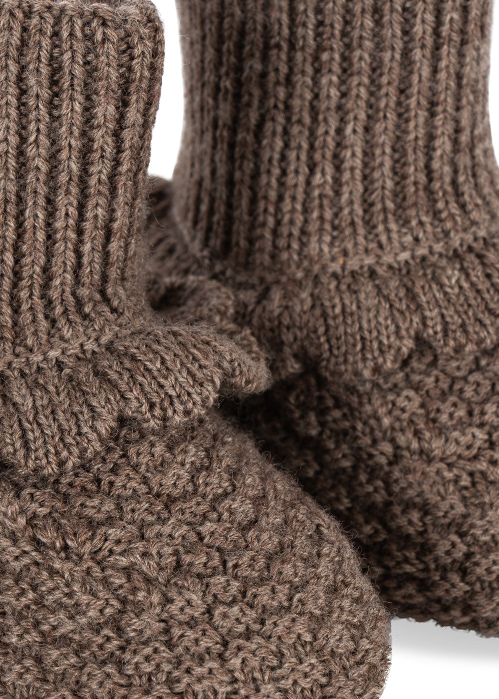 Close-up of pair of Konges Sløjd Fruity booties in Bunny Brown fabric on a white background