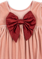 Close-up of the Konges Sløjd Gia Bow Dress in Mellow Rose on a white background.