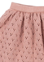 Close-up of the Konges Sløjd Holiday Skirt in Mellow Rose on a white background.