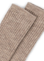 Close-up of Konges Sløjd Lana light knitted socks in sheer bliss on a white background