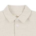 Close‑up of Konges Sløjd Leoni shirt fabric and collar on white background