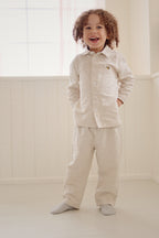 Child wearing a Konges Sløjd Leoni shirt styled in a neutral room