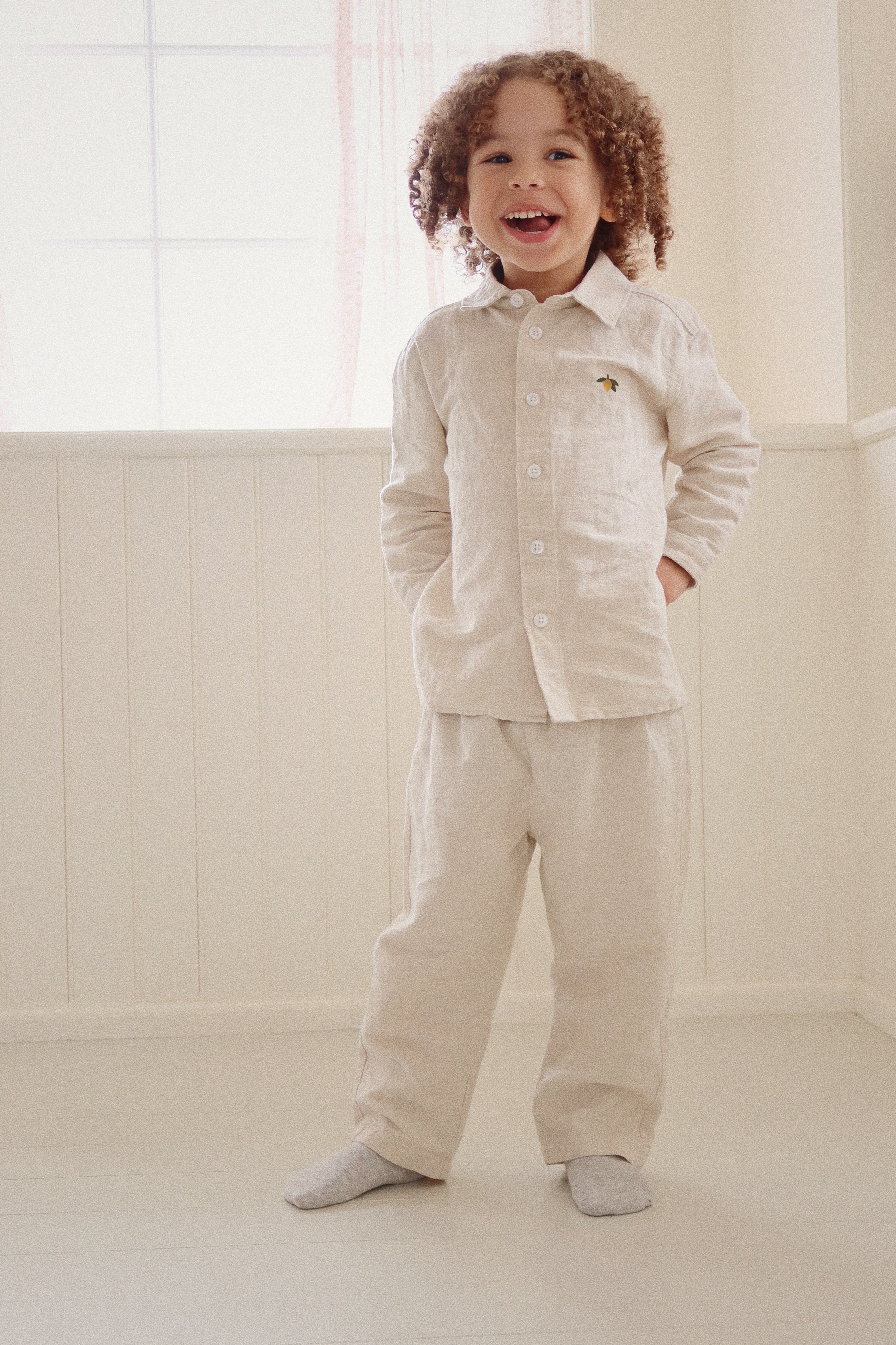 Child wearing a Konges Sløjd Leoni shirt styled in a neutral room
