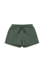 Front view of a Konges Sløjd Lou sweat shorts in cilantro on a white background