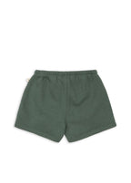 Back view of a Konges Sløjd Lou sweat shorts in cilantro on a white background