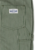 Close-up of the Konges Sløjd Luc Pants in Milk Verte Stripe print on a white background.