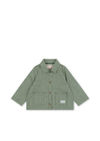 Front view of the Konges Sløjd Luc Shirt Jacket in Milk Verte Stripe print on a white background.