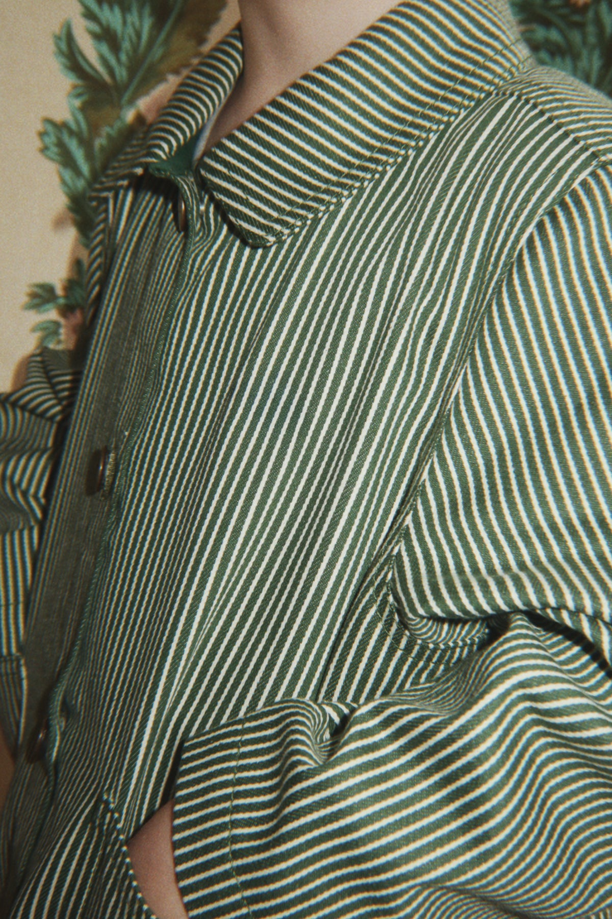 Close-up of the Konges Sløjd Luc Shirt Jacket in Milk Verte Stripe print on a white background.