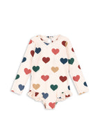 Front view of the Konges Sløjd Manuca longsleeve swimsuit in Bon coeur coloré on a white background