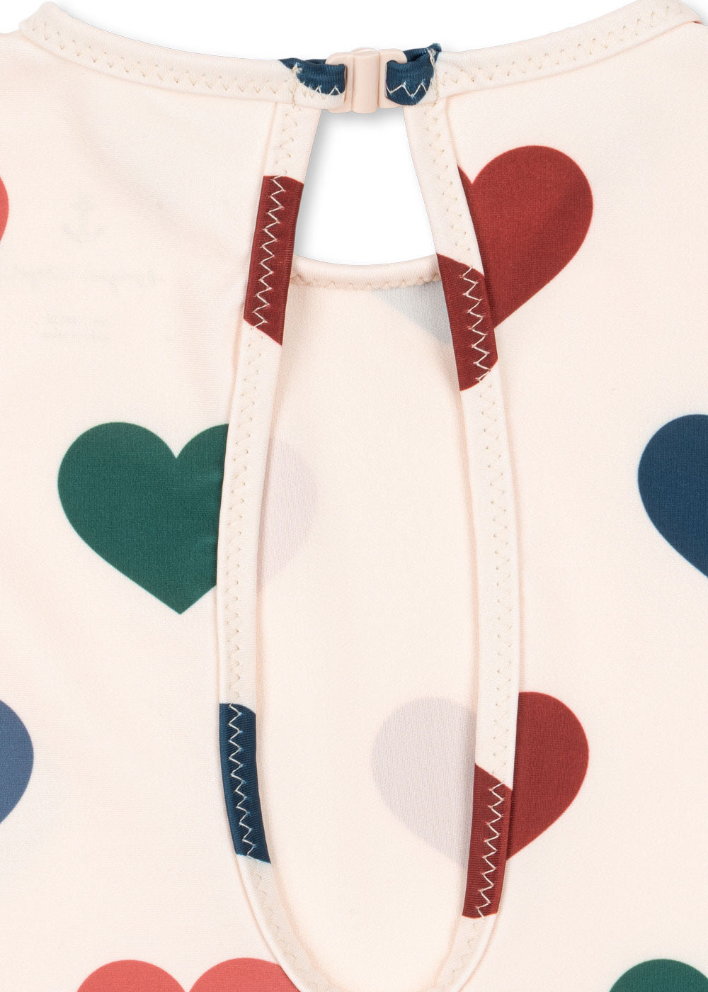 Close-up of a detail from the Konges Sløjd Manuca longsleeve swimsuit in Bon coeur coloré on a white background