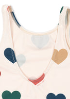 Close-up of a detail of the Konges Sløjd Manuca swimsuit in Bon coeur coloré on a white background