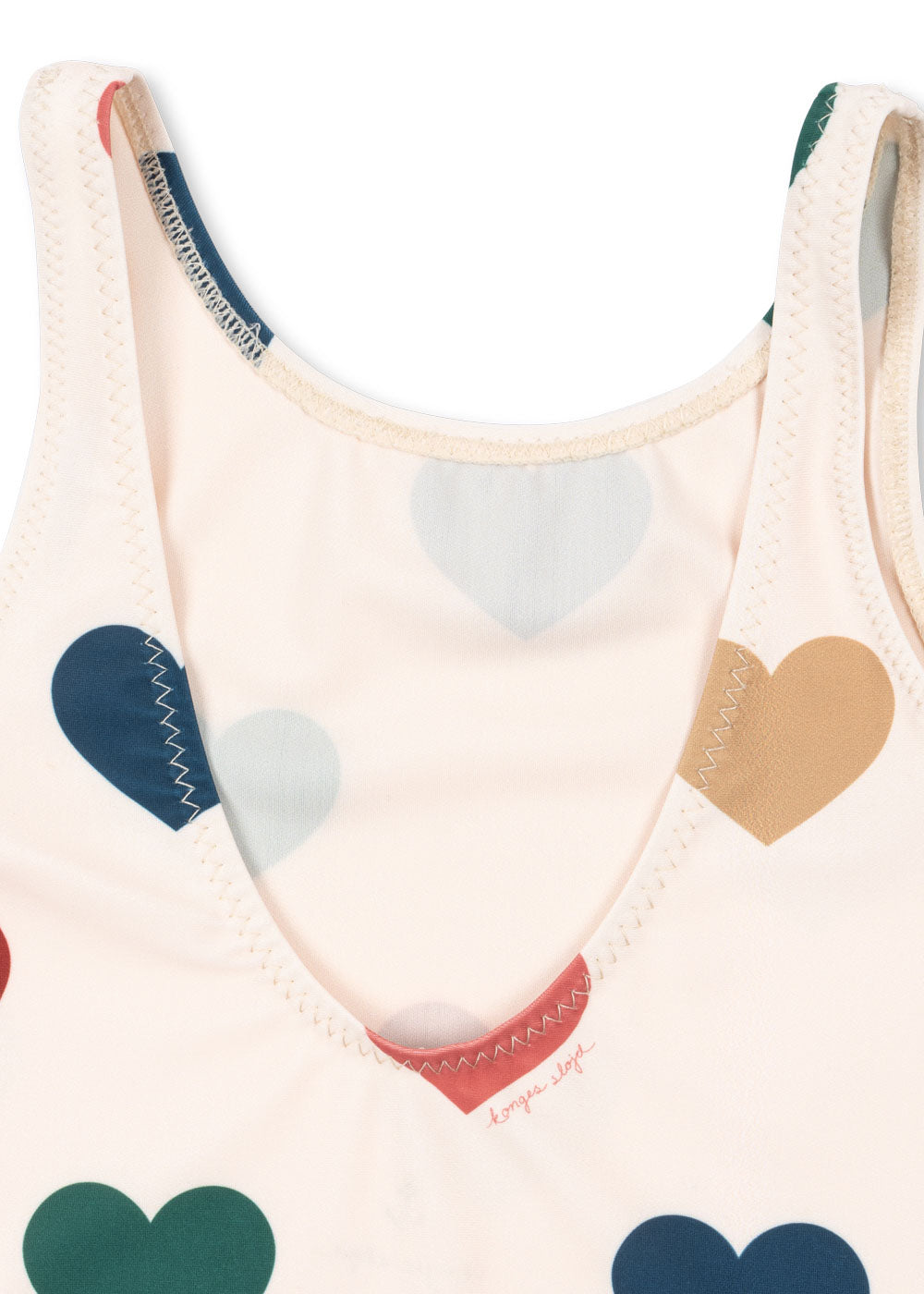 Close-up of a detail of the Konges Sløjd Manuca swimsuit in Bon coeur coloré on a white background