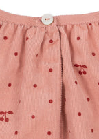 Close-up of the Konges Sløjd Marlo Dress in Cherry Dot Scarlet print on a white background.