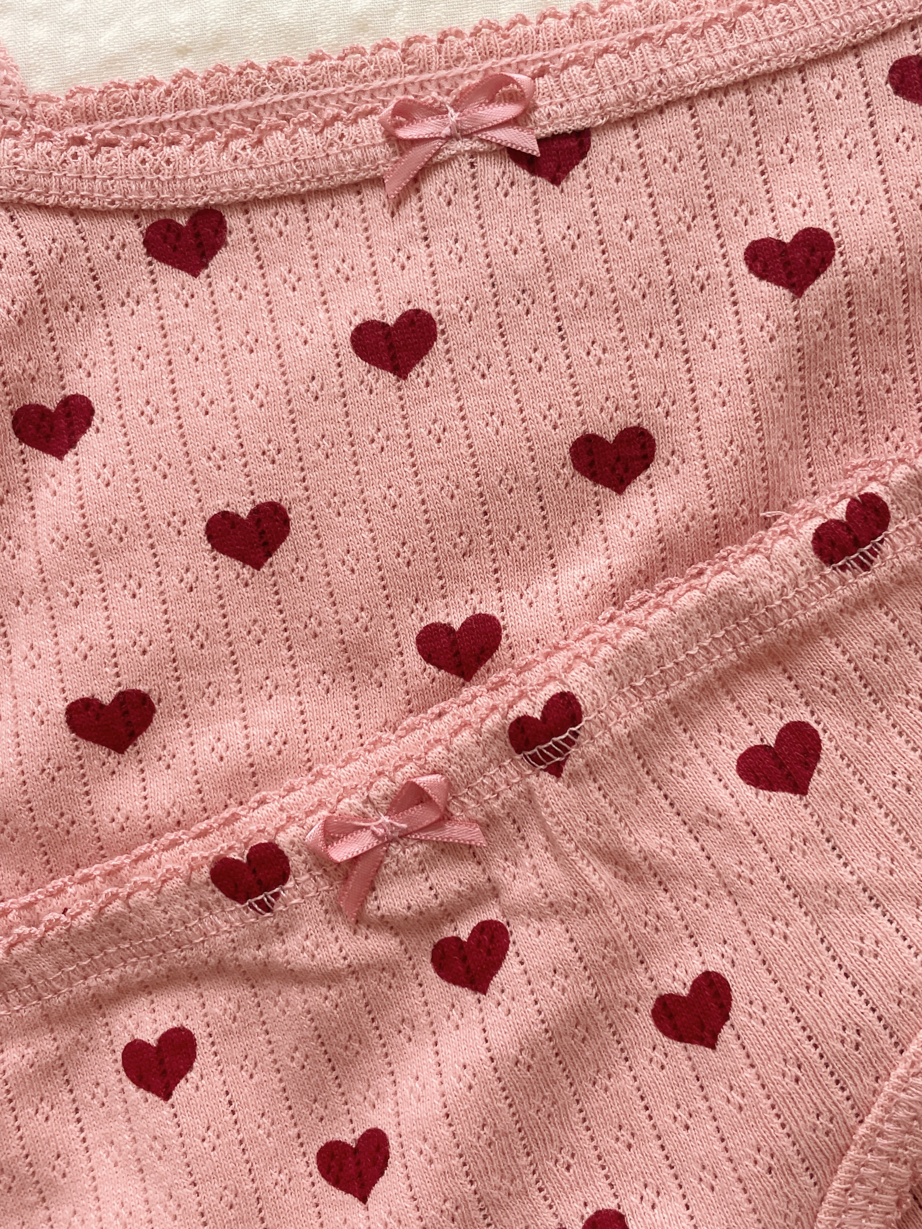 Close-up of Konges Sløjd Minnie underwear in Amour rouge fabric