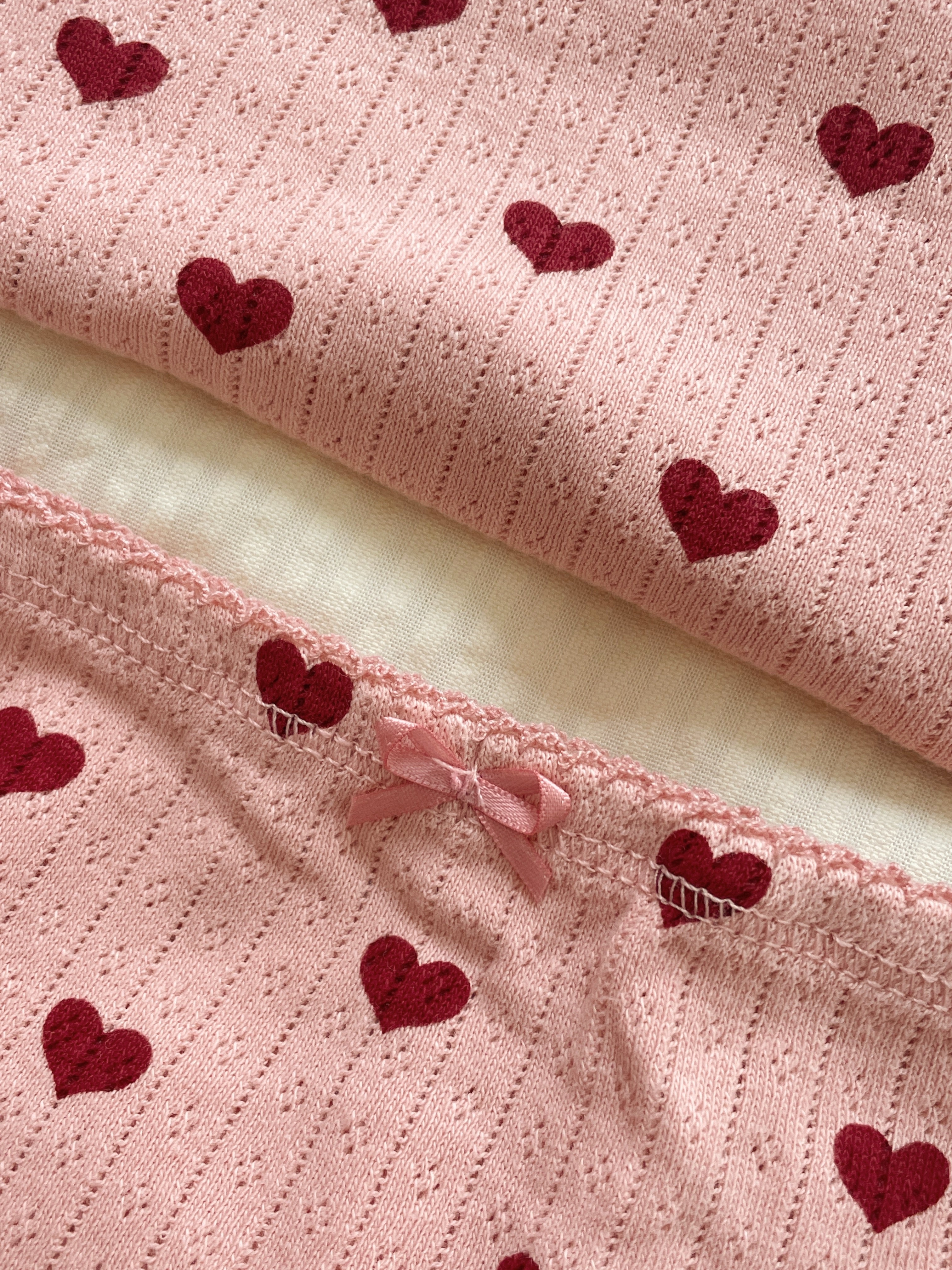 Close-up of Konges Sløjd Minnie underwear in Amour rouge fabric