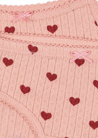Close-up of Konges Sløjd Minnie underwear in Amour rouge fabric