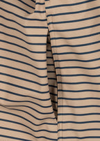 Close-up of a pocket of the Konges Sløjd Rainy Palme Dog rain jacket in Stripe la Mer.