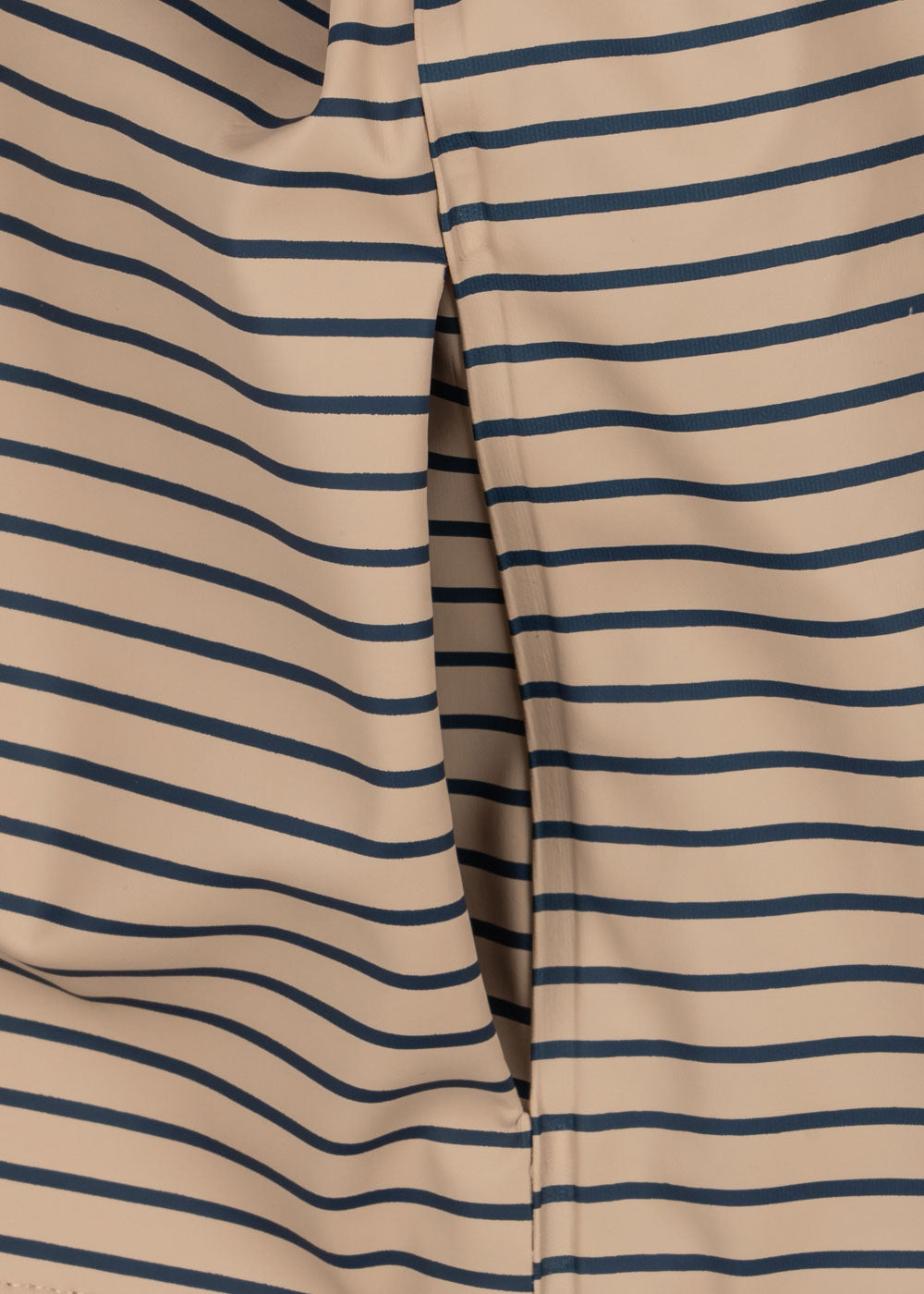 Close-up of a pocket of the Konges Sløjd Rainy Palme Dog rain jacket in Stripe la Mer.