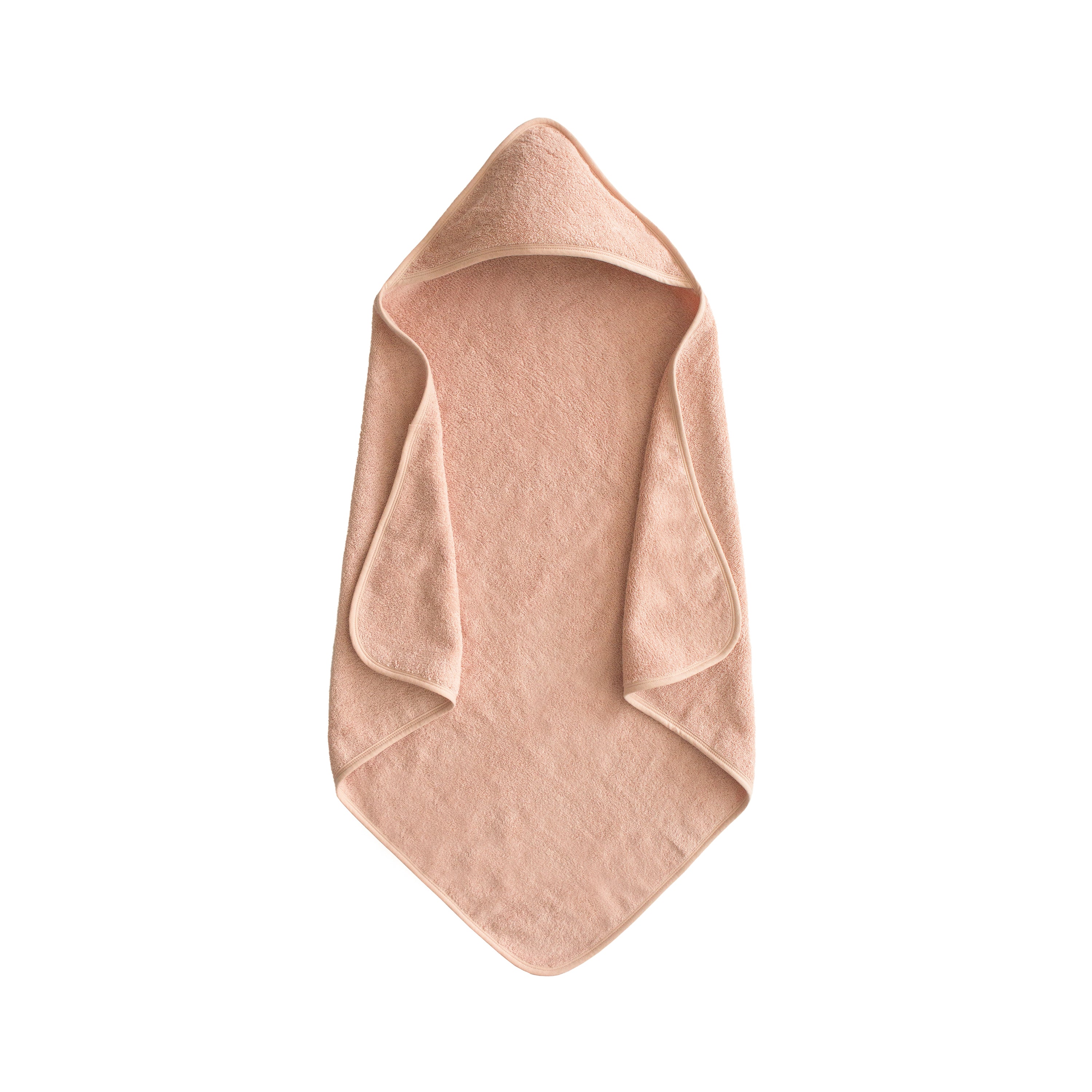 Mushie hooded towel in Blush folded on a white background
