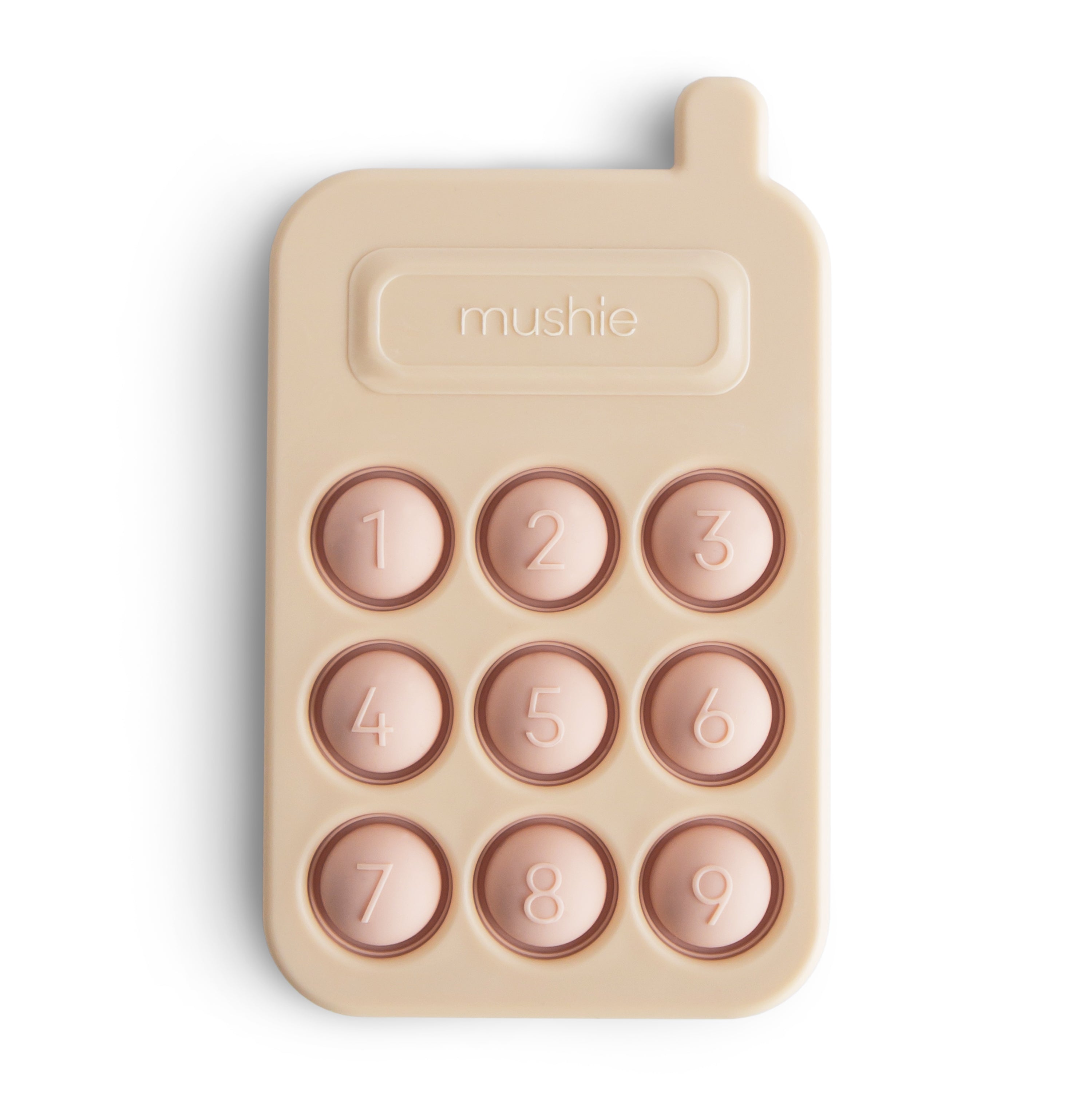 Mushie press toy phone in Blush on a white background