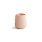 Mushie silicone starter cup in Blush on a white background