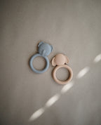 Mushie silicone teether in Dog and Koala on a beige background