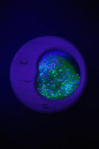 Petit Boum sensory Moon lifestyle image demonstrating its glow-in-the-dark effect