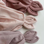 Sage Copenhagen Snoppa cuddle cloth in Mauve with other cuddle cloths in different colors on a neutral background